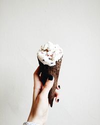 Cropped hand holding ice cream