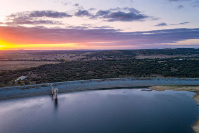 Drone panoramic aerial view of minutos dam in arraiolos alentejo at sunset, portugal