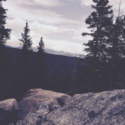 Scenic view of mountains against cloudy sky