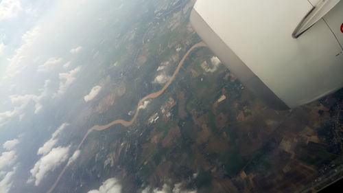 Aerial view of sky seen through airplane window