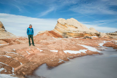 A visitor pauses to soak in the winter magnificence of white pocket az