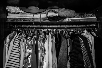 Clothes hanging in rack at store