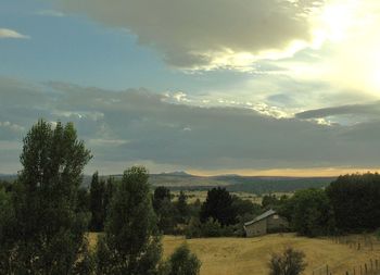 Scenic view of landscape against sky during sunset