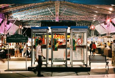 Group of people in market at night