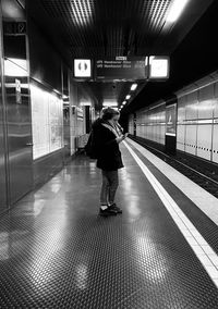 Rear view of man on subway station