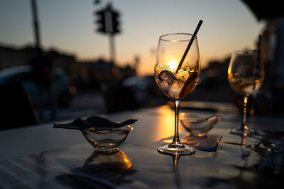 Close-up of wine glasses on table