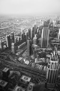 High angle view of modern buildings in city against sky