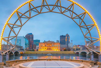 View of bridge and buildings against sky