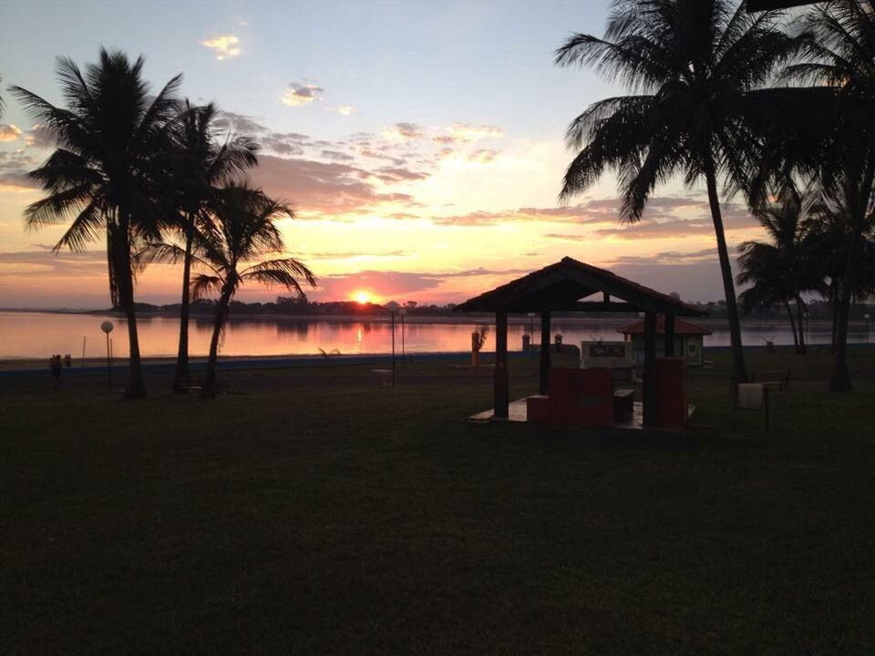 SCENIC VIEW OF BEACH AT SUNSET