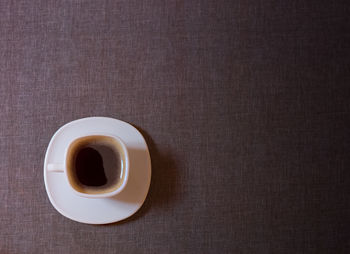 High angle view of coffee cup on table