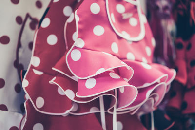 Close-up of garments hanging for sale in store