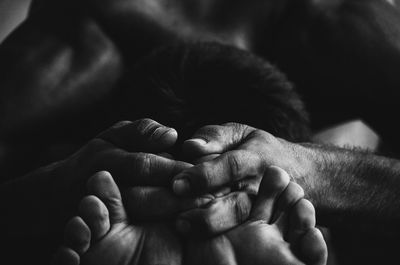 Close-up of couple holding hands