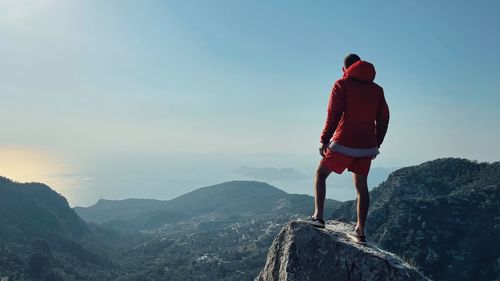 Rear view of man standing on mountain