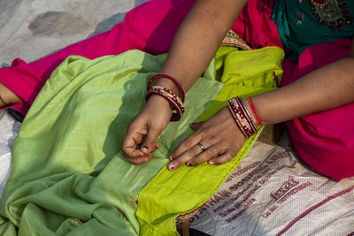 Midsection of woman with hands