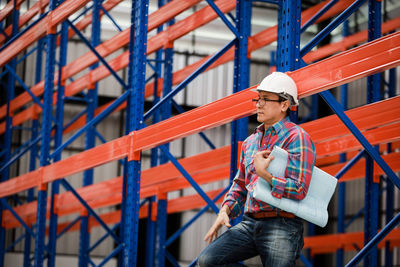 Man working on railing