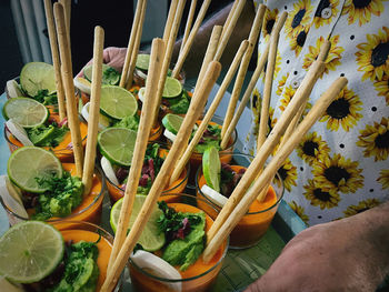 High angle view of fruits and leaves on table