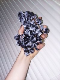 Directly above shot of woman hand holding feet