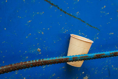 High angle view of rope tied on wall