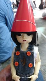 Close-up of girl holding hat