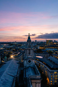 High angle view of illuminated buildings against sky at sunset