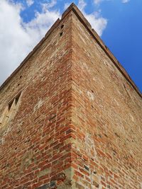 Low angle view of old building against sky