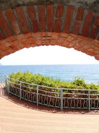 Bridge over sea against sky