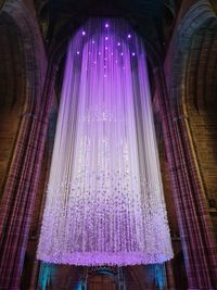 Low angle view of illuminated chandelier