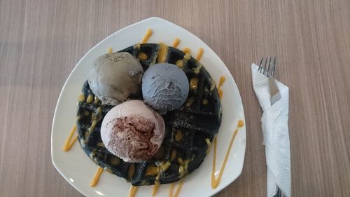 High angle view of ice cream in plate on table