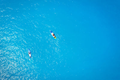 People swimming in sea