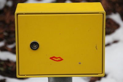 Close-up of yellow mailbox