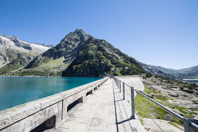 Scenic view of mountains against clear blue sky