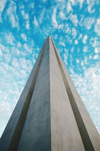 Low angle view of built structure against blue sky