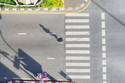 High angle view of person crossing road