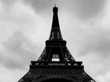 Low angle view of tower against cloudy sky