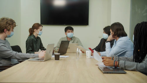 Group of people working on table