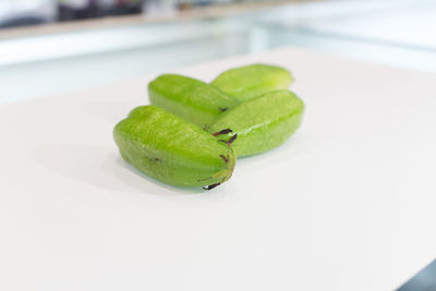 Close-up of green leaf on plate