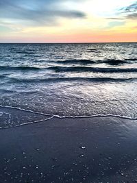 Scenic view of sea against dramatic sky