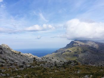 Scenic view of sea against cloudy sky