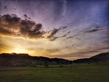Scenic view of dramatic sky over land