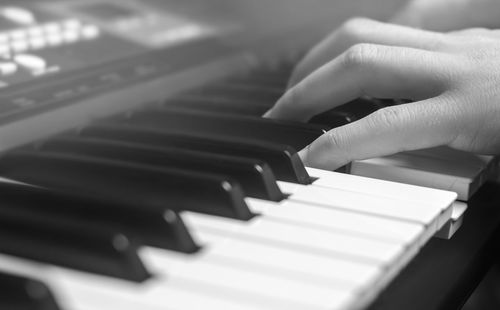 Close-up of a music performer's hand playing the piano, man's hand, classical music, keyboard