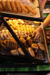 Cropped hand of woman holding food