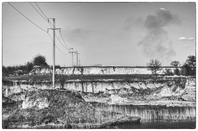 View of power lines against sky