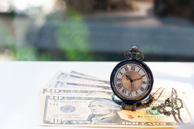 Close-up of clock on table