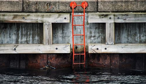 Close-up of pipe against water