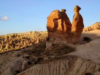 Rock formations in desert against sky