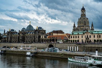 View of cathedral in city against cloudy sky