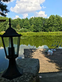 Gazebo in lake against sky