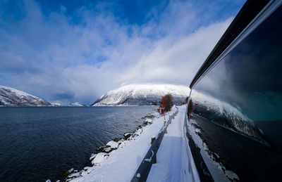 Scenic view of frozen lake against sky