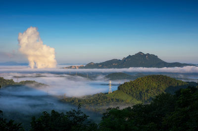 Scenic view of waterfall against sky