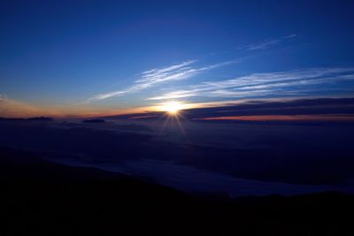 Scenic view of silhouette landscape against romantic sky at sunset